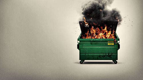 A dumpster, on fire