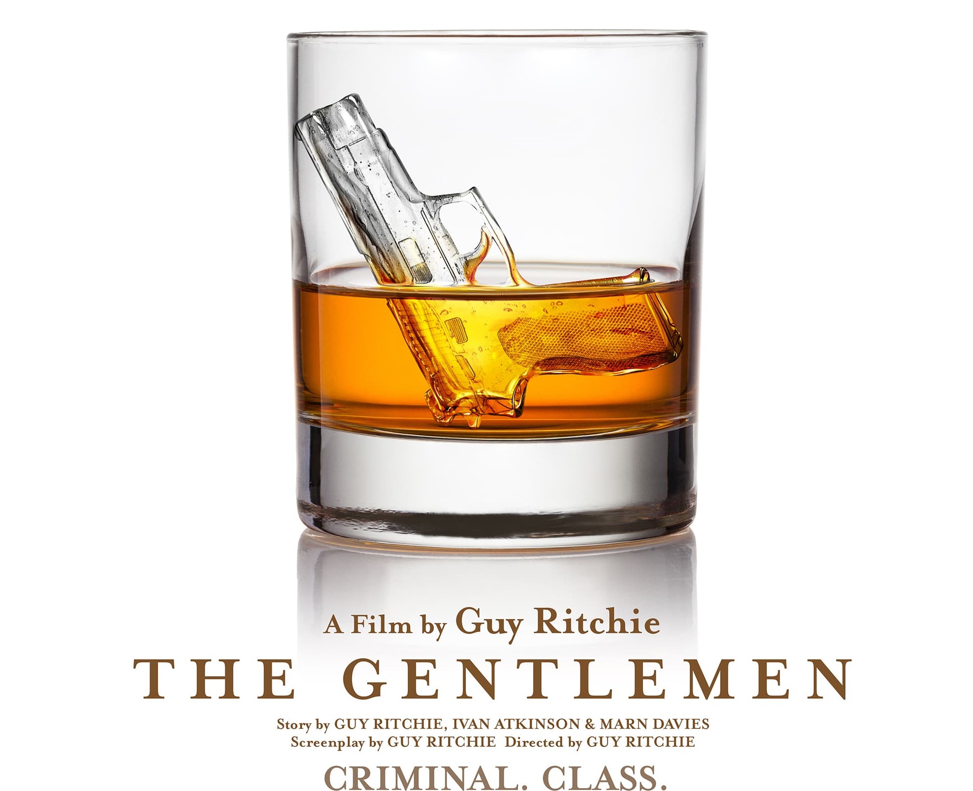 Title: The Gentlemen underneath a glass of whisky with a gun shaped ice cube