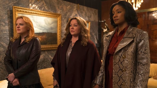 Three women standing in an expensive looking room looking very serious