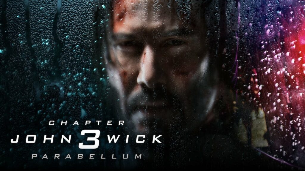 Promo poster of John Wick 3 with the lead actor looking through a rain streaked window